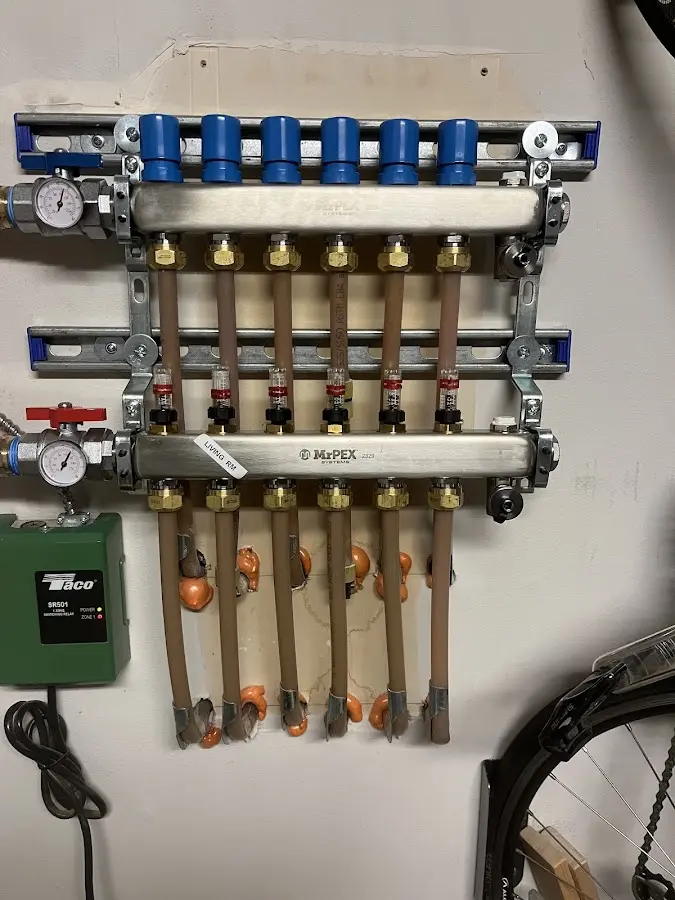 Plumber performing Gas Line Installation at a residential property in Laurel